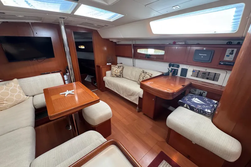 Slide: The Image of Luxurious interior of 2007 Beneteau Oceanis 49 yacht with cozy seating and modern amenities. - 16