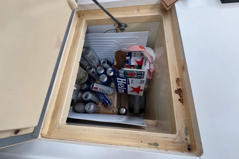 Slide: The Image of Cooler on 2007 Beneteau Oceanis 49 yacht filled with assorted beverage cans. - 19