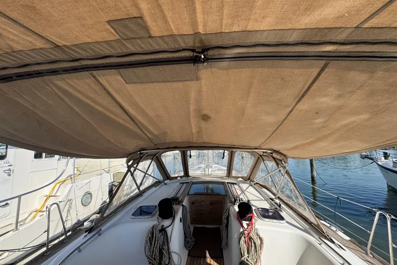 Slide: The Image of 2007 Beneteau Oceanis 49 sailboat cockpit with canopy, docked at marina. - 22