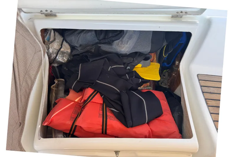 Slide: The Image of Storage compartment on a 2007 Beneteau Oceanis 49 sailboat filled with gear and equipment. - 27