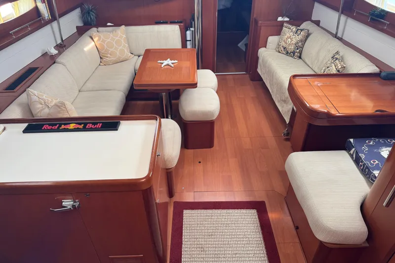 Slide: The Image of Luxurious interior of a 2007 Beneteau Oceanis 49 yacht with elegant seating and wooden finishes. - 3
