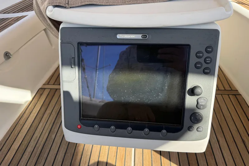 Slide: The Image of Raymarine E120 navigation display on 2007 Beneteau Oceanis 49 yacht, teak deck background. - 30