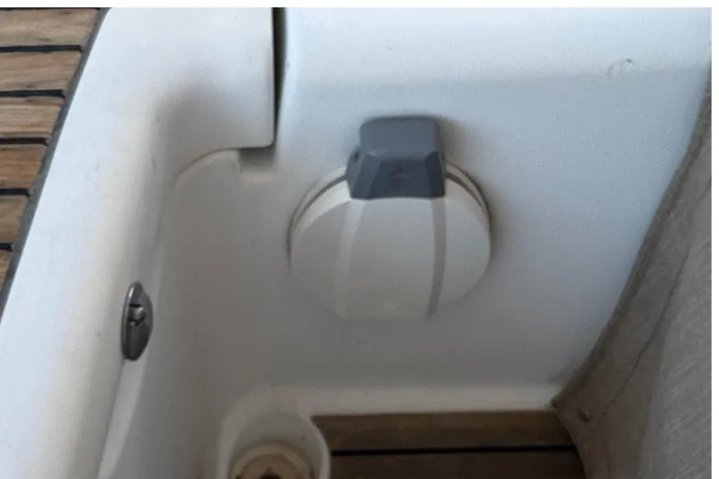 Slide: The Image of Deck detail of a 2007 Beneteau Oceanis 49 sailboat, featuring a white circular fixture. - 32