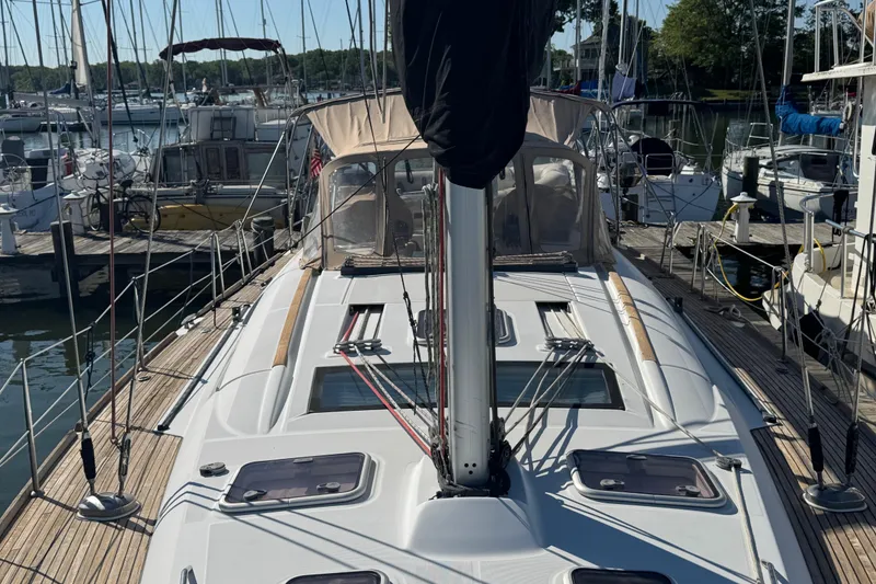 Slide: The Image of 2007 Beneteau Oceanis 49 sailboat docked at marina, showcasing deck and rigging. - 34