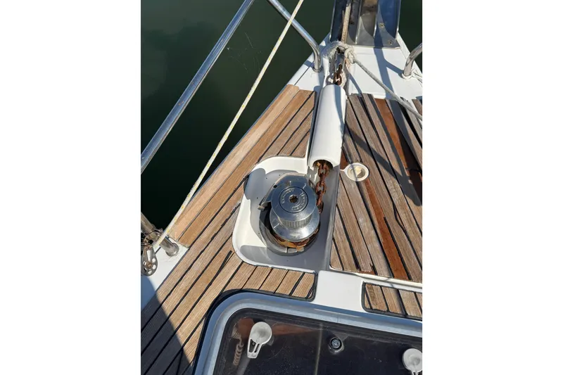 Slide: The Image of Deck of 2007 Beneteau Oceanis 49 sailboat with anchor winch and teak flooring. - 35