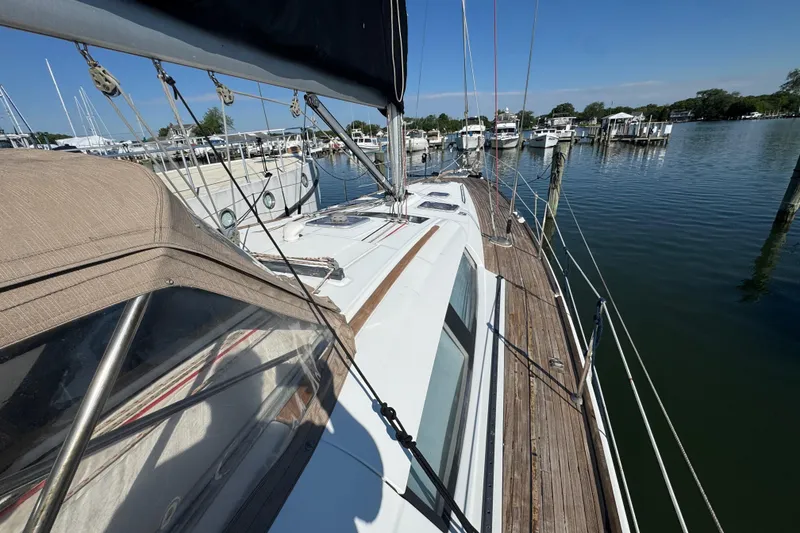 Slide: The Image of 2007 Beneteau Oceanis 49 sailboat docked at a marina, showcasing deck and rigging. - 40