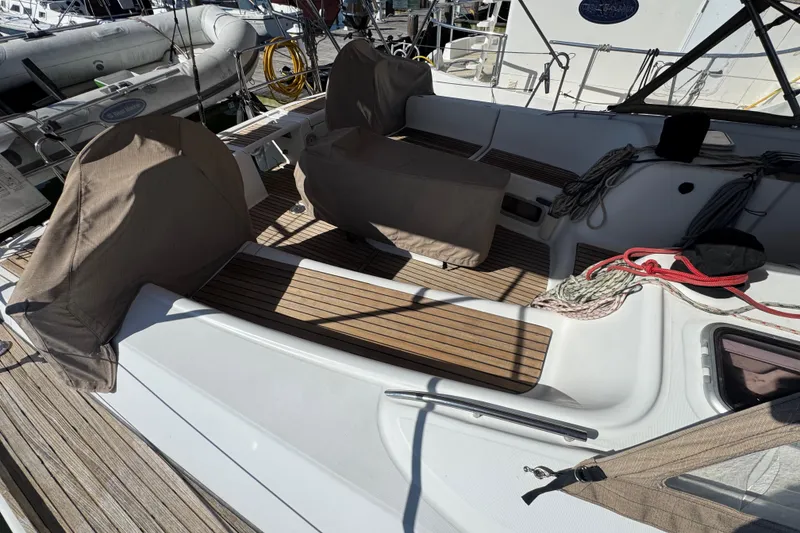Slide: The Image of 2007 Beneteau Oceanis 49 yacht deck with covered seating and nautical ropes. - 41