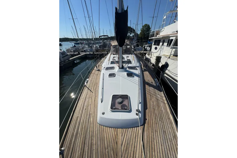 Slide: The Image of 2007 Beneteau Oceanis 49 sailboat docked, showcasing sleek deck design and marina setting. - 45