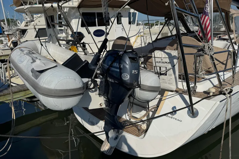 Slide: The Image of Beneteau Oceanis 49 sailboat, 2007 model, docked with inflatable dinghy and Yamaha outboard motor. - 48
