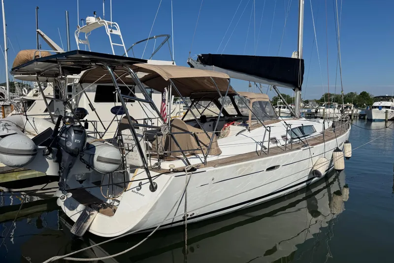 Slide: The Image of 2007 Beneteau Oceanis 49 sailboat docked in marina, featuring sleek design and modern amenities. - 52