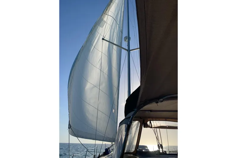 Slide: The Image of Sailing on a 2007 Beneteau 49 yacht with full sails against a clear blue sky. - 55