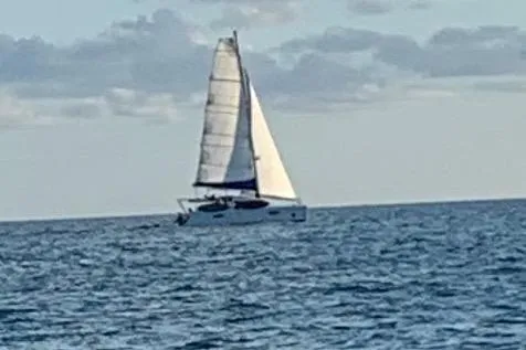 Slide: The Image of Sailing yacht Beneteau 49, 2007 model, cruising on open sea under clear skies. - 58