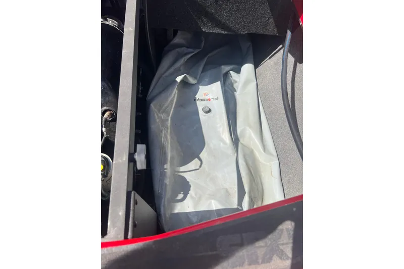 Slide: The Image of Interior view of a 2016 Axis T22 boat compartment with a gray ballast bag. - 10