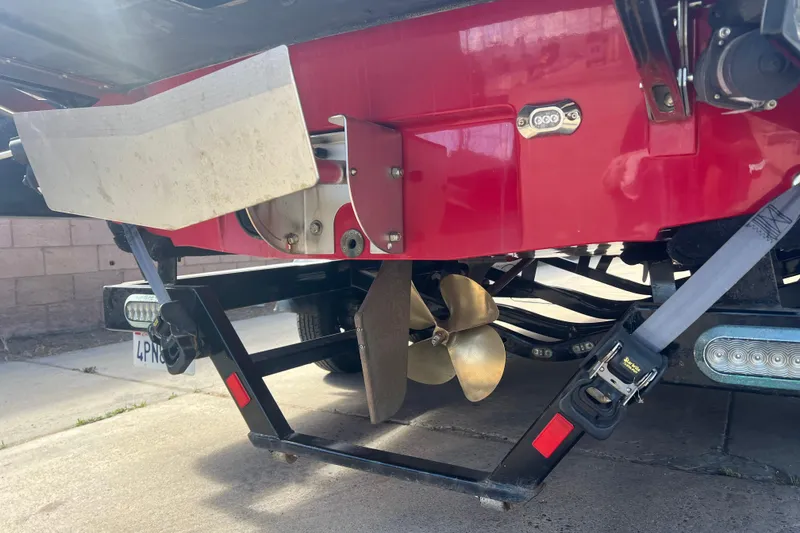 Slide: The Image of Rear view of a 2016 Axis T22 boat showing propeller and trailer details. - 11
