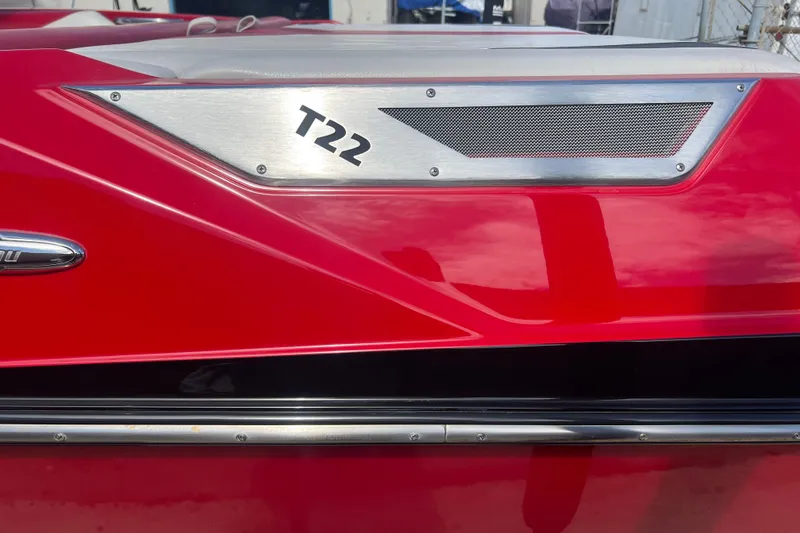 Slide: The Image of Red 2016 Axis T22 boat with sleek design and metallic accents. - 12