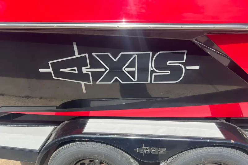 Slide: The Image of 2016 Axis T22 boat with bold logo on a red and black exterior. - 13
