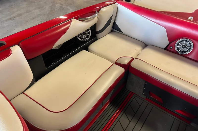 Slide: The Image of Red and beige interior seating of a 2016 Axis T22 boat with built-in speakers. - 31