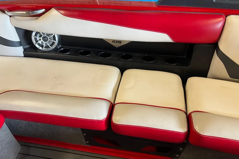 Slide: The Image of Red and white seating with speaker and cup holders in 2016 Axis T22 boat. - 32