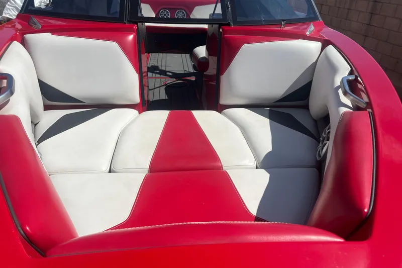Slide: The Image of 2016 Axis T22 boat interior with red and white seating. - 38