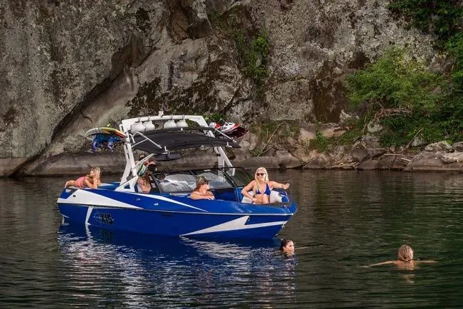 Slide: The Image of Manufacturer Provided Image: 2016 Axis T22 boat with people swimming and relaxing near rocky shore. - 43