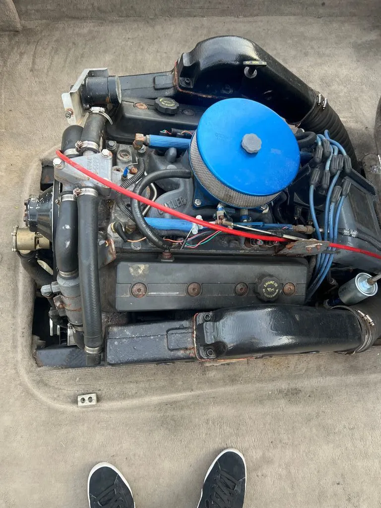 Slide: The Image of Engine of a 1997 Malibu Sunsetter LX boat with blue air filter. - 11