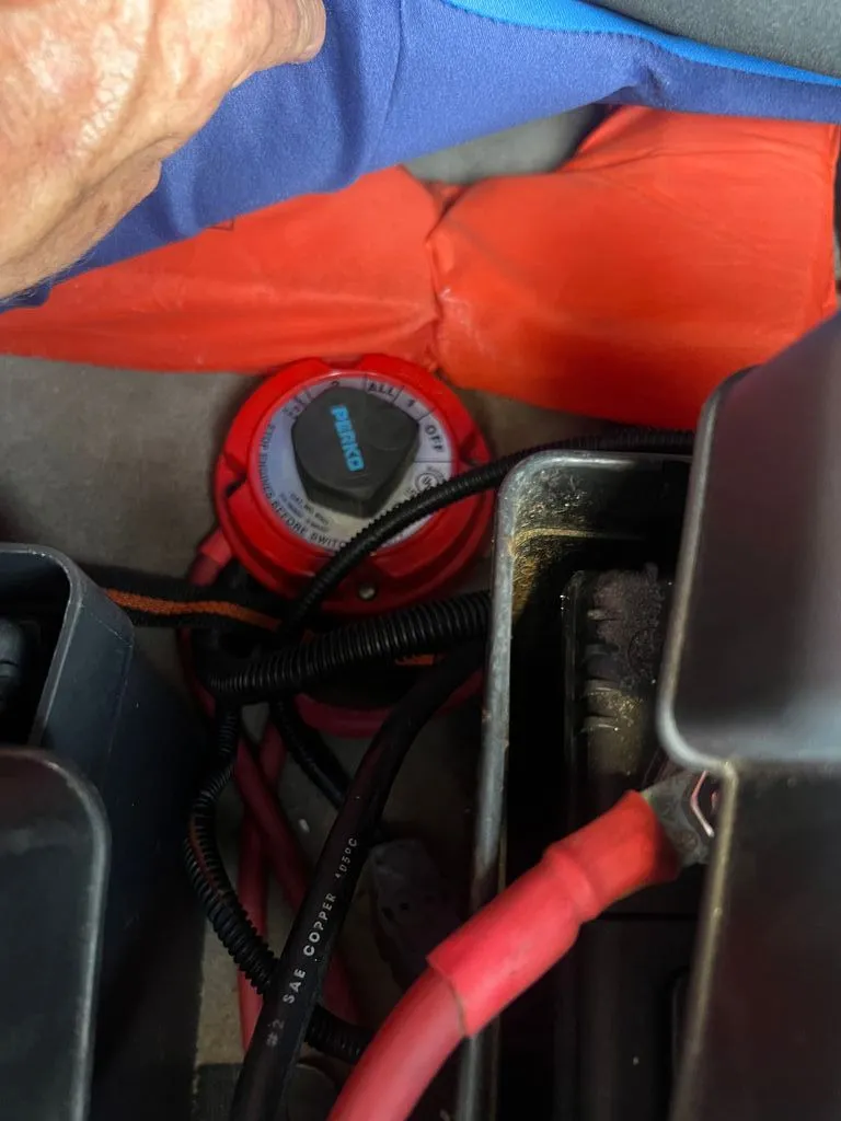 Slide: The Image of Close-up of a 1997 Malibu Sunsetter LX boat component with cables. - 12
