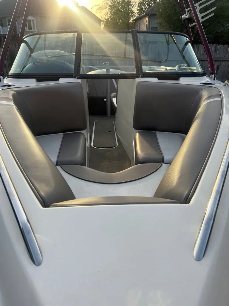 Slide: The Image of Interior of a 1997 Malibu Sunsetter LX boat at sunset. - 2