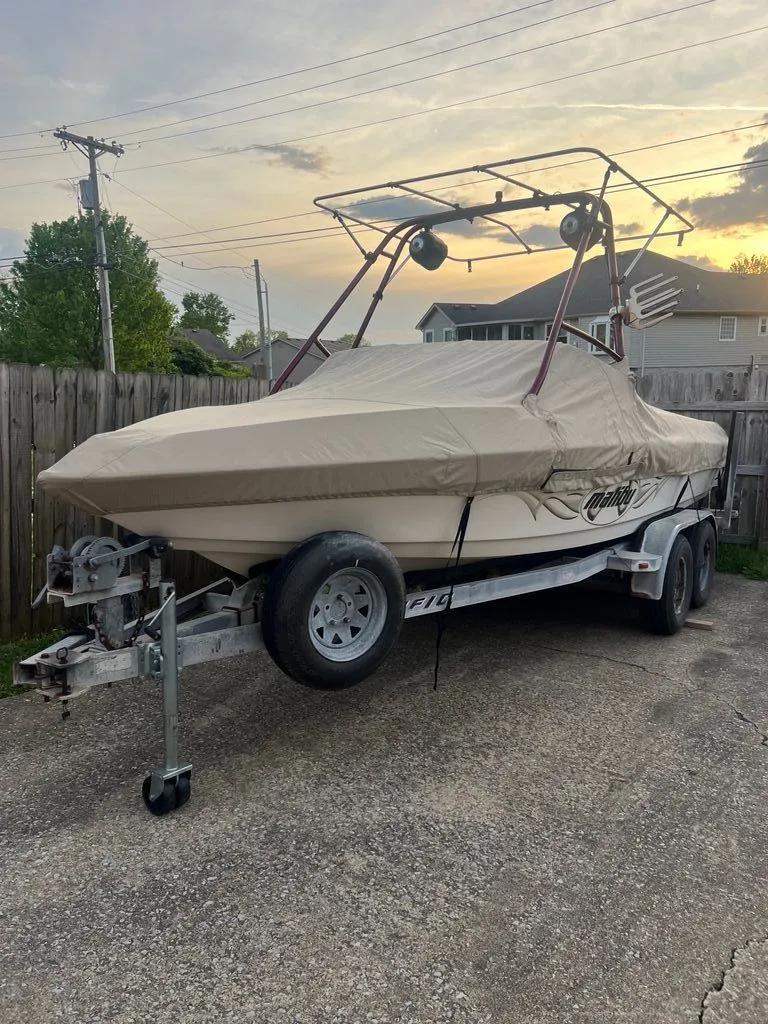 Slide: The Image of 1997 Malibu Sunsetter LX boat on trailer, covered, at sunset. - 7