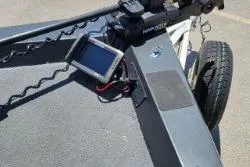 Slide: The Image of 2007 Xpress X17 boat with mounted electronic device and trailer wheel. - 3