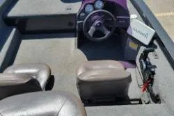 Slide: The Image of 2007 Xpress X17 boat interior with steering wheel and Garmin device. - 6