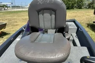 Slide: The Image of 2007 Xpress X17 boat seat, gray upholstery, outdoor setting. - 9