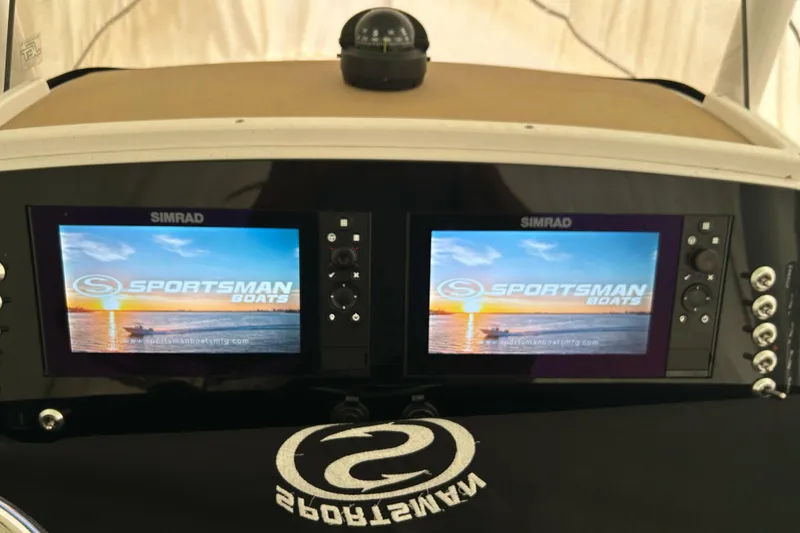 Slide: The Image of 2018 Sportsman Heritage 231 Center Console dashboard with dual Simrad displays. - 10
