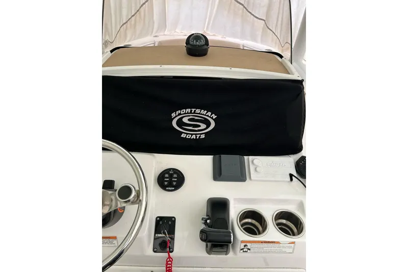 Slide: The Image of 2018 Sportsman Heritage 231 Center Console dashboard with steering wheel and controls. - 6