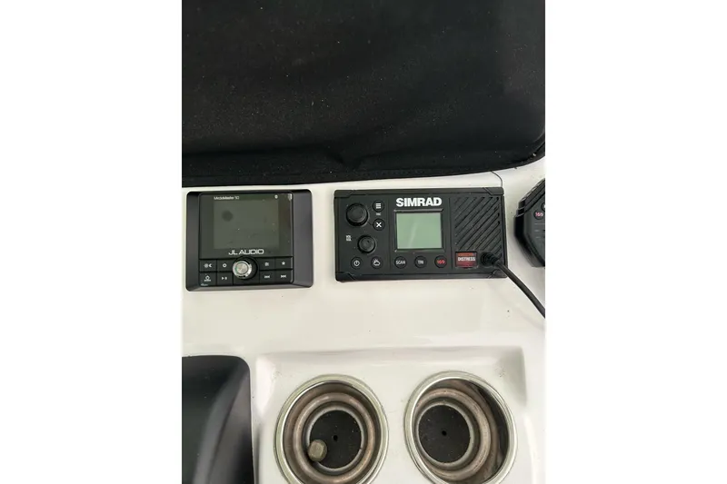 Slide: The Image of 2018 Sportsman Heritage 231 Center Console dashboard with JL Audio and Simrad electronics. - 8