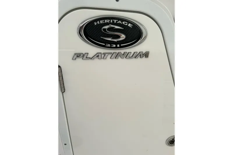 Slide: The Image of 2018 Sportsman Heritage 231 Center Console boat emblem with "Platinum" badge. - 9