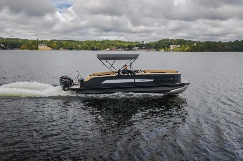 Slide: The Image of 2026 Evotti 525QL pontoon boat cruising on a lake under cloudy skies. - 71