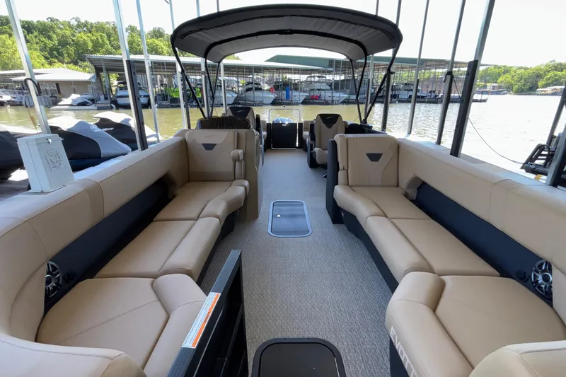 Slide: The Image of Luxurious 2026 Evotti 525QL pontoon boat with spacious seating and canopy at a marina. - 10