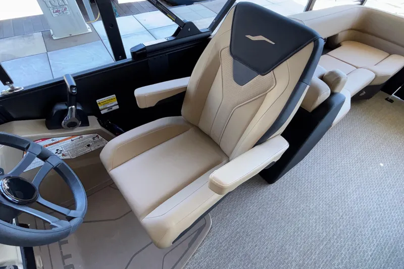 Slide: The Image of Captain's chair in 2026 Evotti 525QL boat, featuring beige upholstery and ergonomic design. - 18