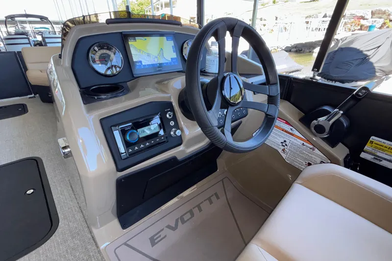 Slide: The Image of Interior view of 2026 Evotti 525QL boat dashboard with steering wheel and navigation system. - 20