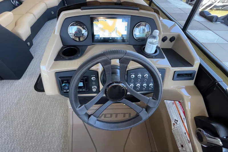 Slide: The Image of Cockpit of 2026 Evotti 525QL boat with steering wheel and navigation display. - 21