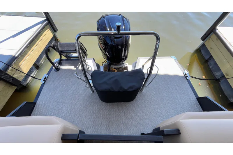 Slide: The Image of Evotti 525QL 2026 boat stern view with motor and docked at marina. - 28