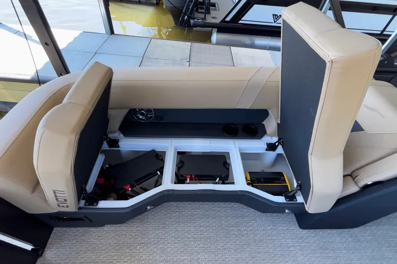Slide: The Image of Open storage compartment in Evotti 525QL boat, showcasing interior features and equipment. - 33