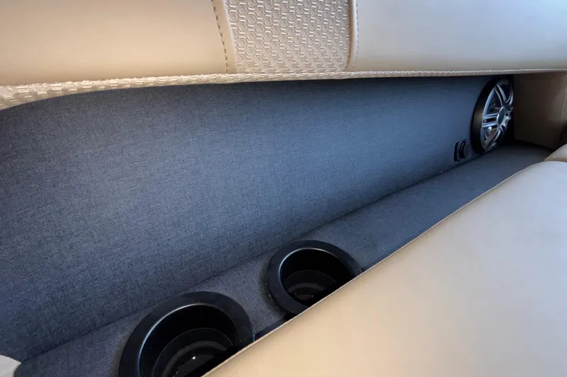 Slide: The Image of Interior of 2026 Evotti 525QL showing cup holders and speaker detail. - 35
