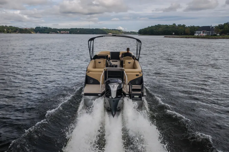 Slide: The Image of 2026 Evotti 525QL boat cruising on a scenic lake under cloudy skies. - 68