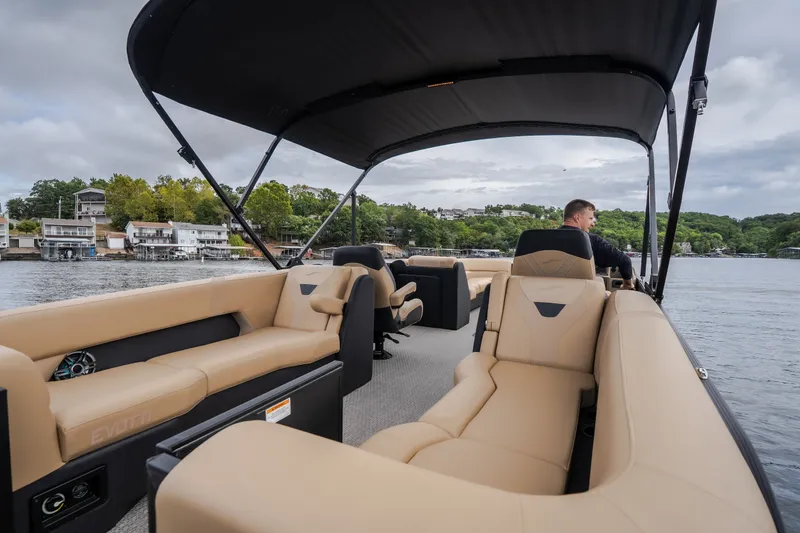 Slide: The Image of Luxurious 2026 Evotti 525QL pontoon boat cruising on a scenic lake. - 49
