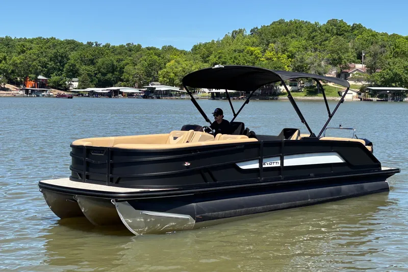 Slide: The Image of 2026 Evotti 525QL pontoon boat cruising on a scenic lake. - 5