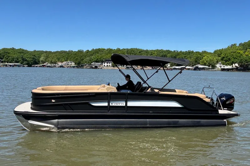 Slide: The Image of 2026 Evotti 525QL pontoon boat on a lake, featuring sleek design and canopy. - 6