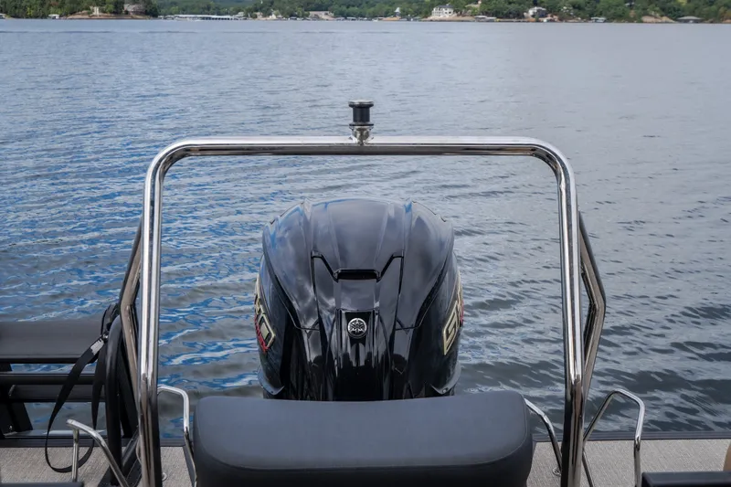 Slide: The Image of Evotti 525QL 2026 boat engine on a calm lake with scenic background. - 54