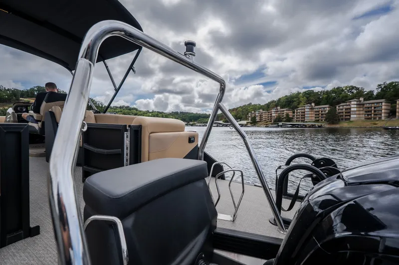 Slide: The Image of Luxury Evotti 525QL boat interior on a scenic lake, 2026 model. - 57