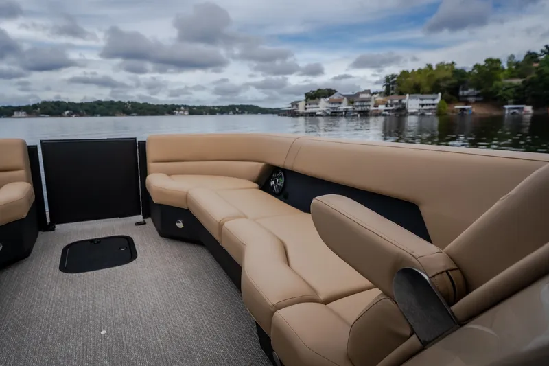 Slide: The Image of Luxurious interior of 2026 Evotti 525QL boat with beige seating on a serene lake. - 20